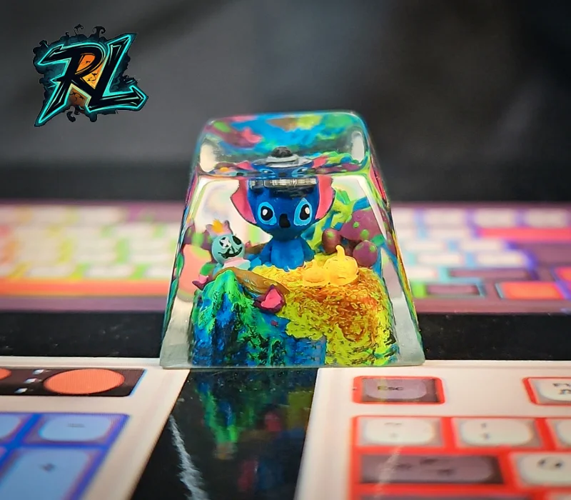 Keycap Mold 3D Print: The Ultimate Step-by-Step Guide 5 Keycap Mold 3D Print: A miniature blue Stitch figurine sitting on an uneven rocky mountain base with tiny handmade polymer clay mushrooms and exotic plants inside clear resin
