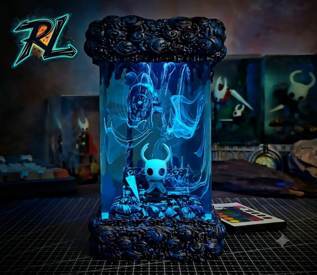What Is Resin Material? All About Premium Epoxy Lamps 3 What Is Resin Material? Deep blue illumination filtering through a clear 3D night light with a small knight figure standing in swirling mists
